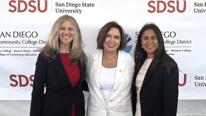 Dean Amy Bonomi, President Adele De La Torre, and Geysil Arroyo taking a photo together.