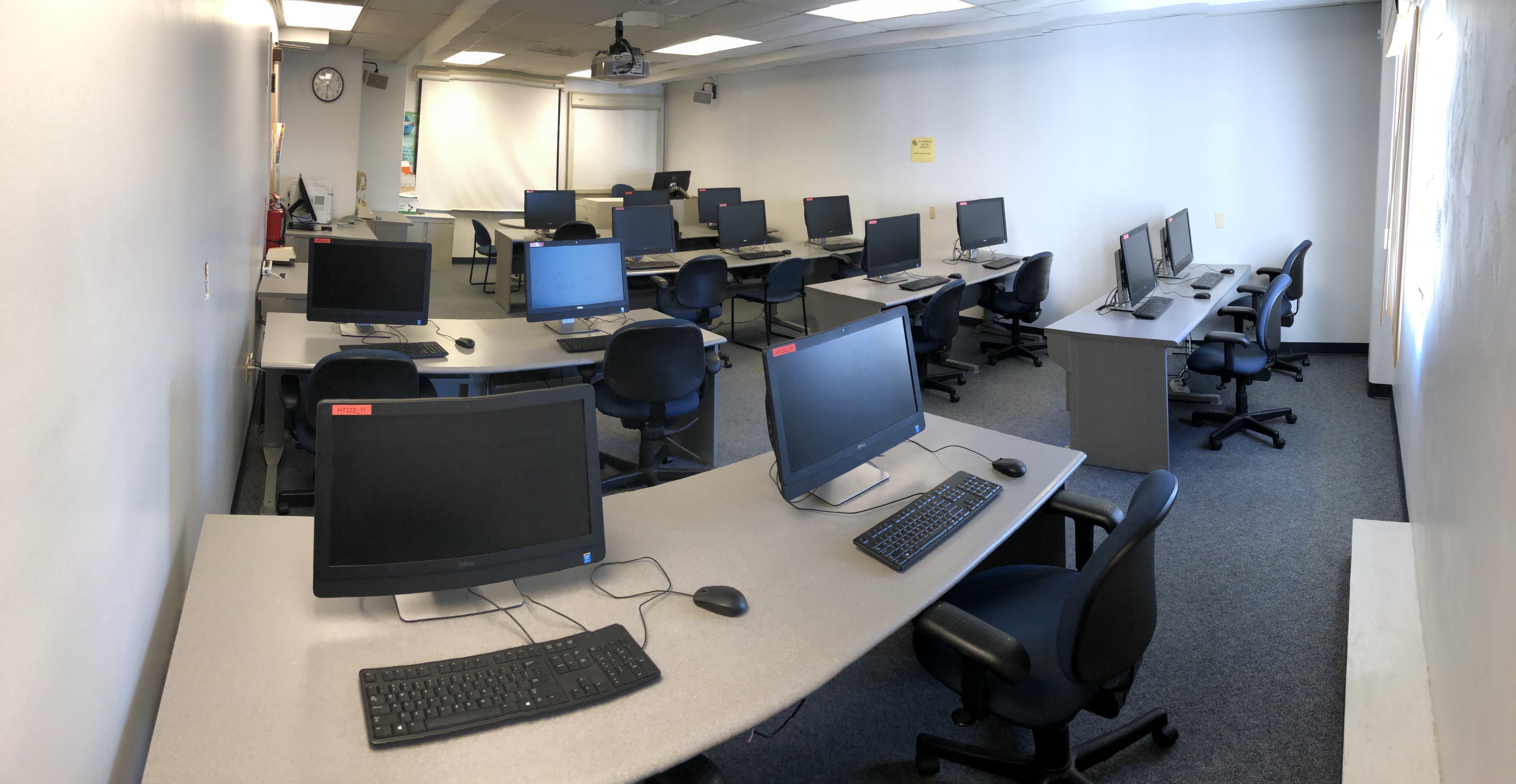 Room with multiple computers and a projector