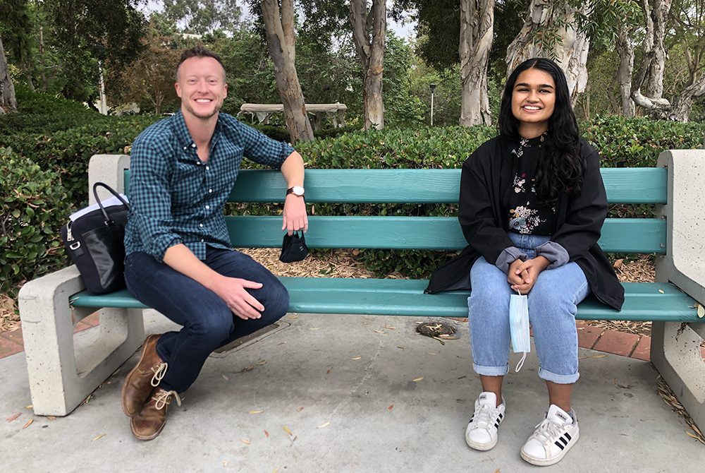 Sandhya and Dr. Storholm sitting on a bench at SDSU