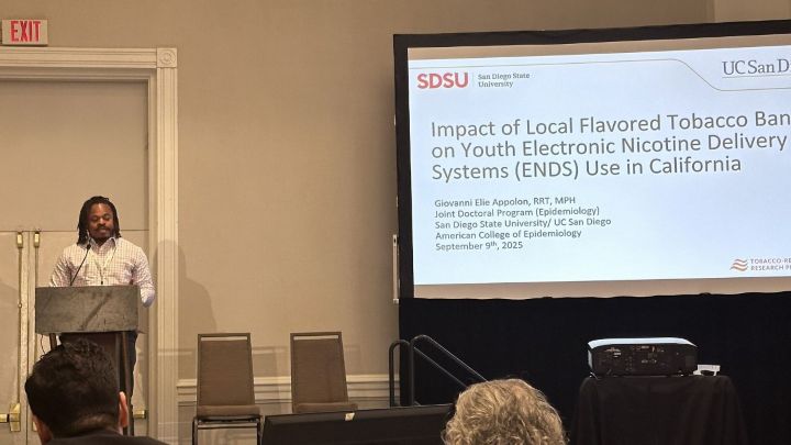 Giovanni giving a presentation about tabacco